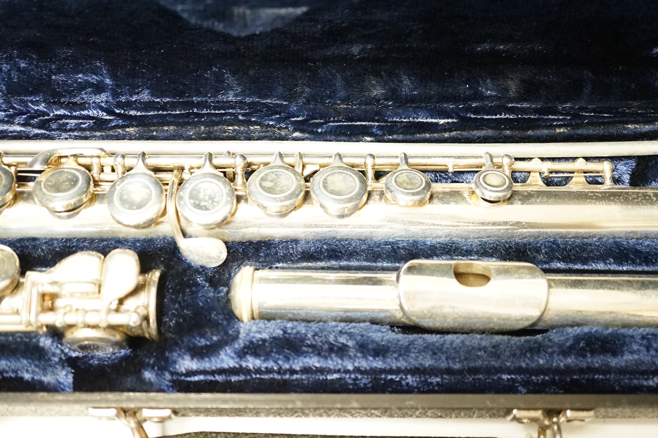 A cased Boosey and Hawkes 400 flute with closed hole key work